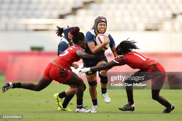 Haruka Hirotsu of Team Japan is tackled in the Women’s Placing 9-12 match between Team Kenya and Team Japan during the Rugby Sevens on day seven of...