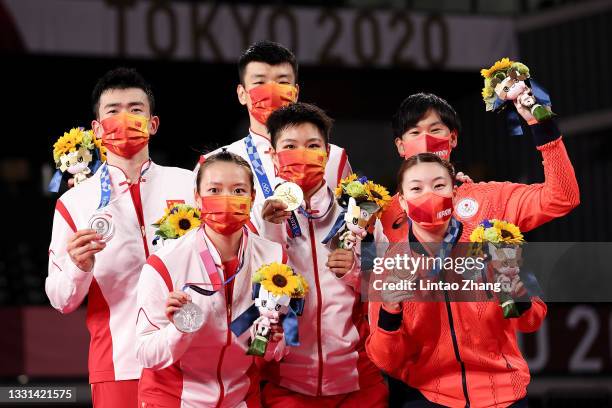 Silver medalists Zheng Si Wei and Huang Ya Qiong of Team China, gold medalists Wang Yi Lyu and Huang Dong Ping of Team China and bronze medalists...