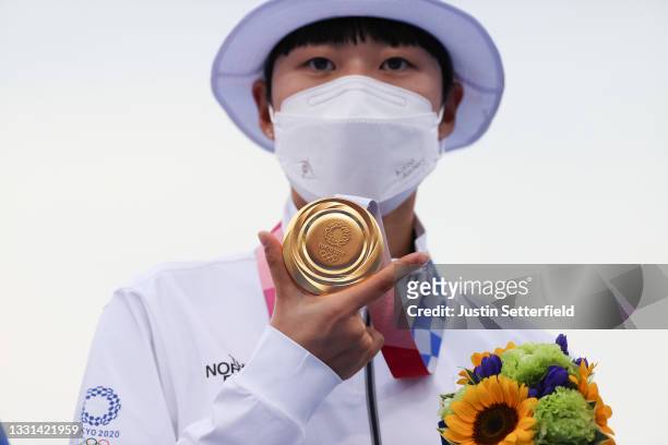 San An of Team South Korea poses with the gold medal for the archery Women’s Individual competition on day seven of the Tokyo 2020 Olympic Games at...
