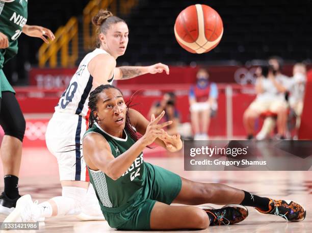 Oderah Chidom of Team Nigeria fights for possesion of the ball with Alix Duchet of Team France during the first half of a Women's Basketball...