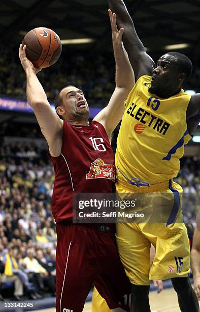 Christophe Beghin, #16 of Belgacom Spirou Basket competes with Shawn James, #15 of Maccabi Electra Tel Aviv during the 2011-2012 Turkish Airlines...