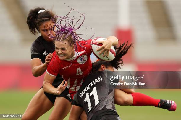 Alena Tiron of Team ROC is tackled in the Women’s Quarter Final match between Team New Zealand and Team ROC during the Rugby Sevens on day seven of...