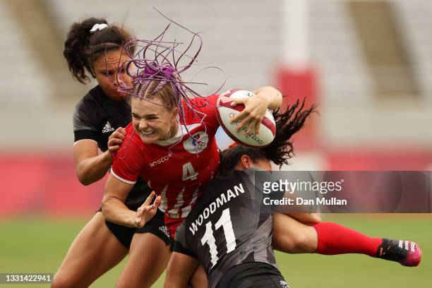 Alena Tiron of Team ROC is tackled in the Women’s Quarter Final match between Team New Zealand and Team ROC during the Rugby Sevens on day seven of...