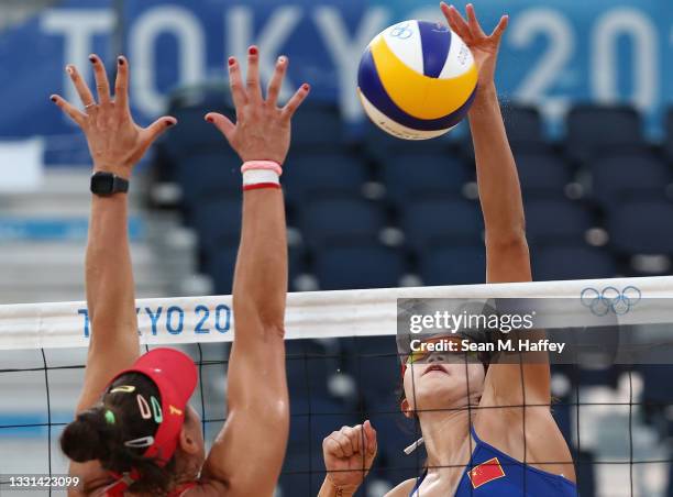 Xinxin Wang of Team China competes against Liliana Fernandez Steiner of Team Spain during the Women's Preliminary - Pool B beach volleyball on day...