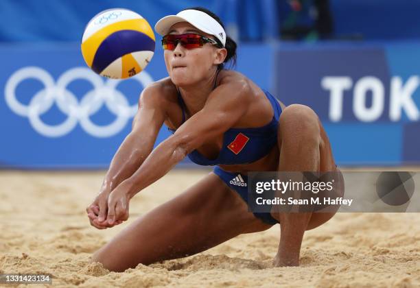 Chen Xue of Team China competes against Team Spain during the Women's Preliminary - Pool B beach volleyball on day seven of the Tokyo 2020 Olympic...