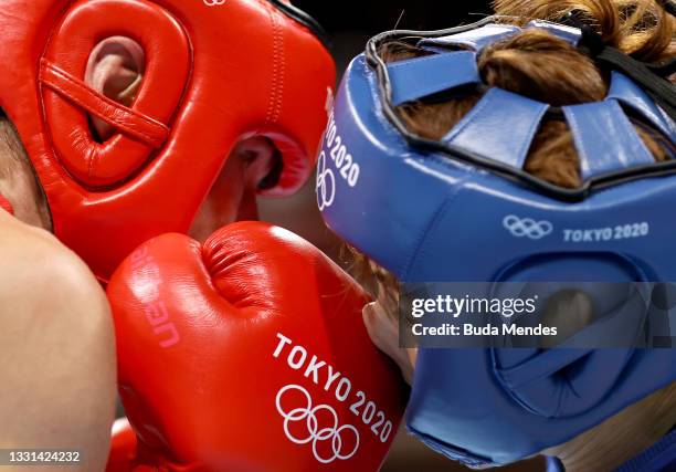 Mira Marjut Potkonen of Team Finland exchanges punches with Yeonji Oh of Team South Korea during the Women's Light on day seven of the Tokyo 2020...