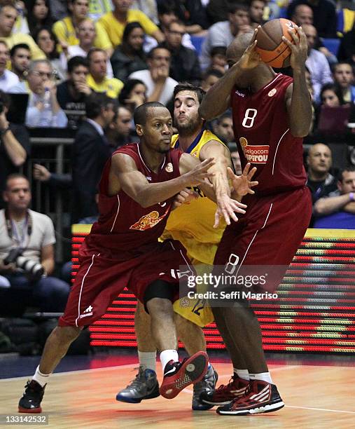 Demond Mallet, #12 of Belgacom Spirou Basket competes with Yogev Ohayon, #12 of Maccabi Electra Tel Aviv during the 2011-2012 Turkish Airlines...