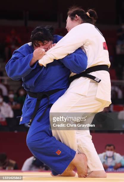 Iryna Kindzerska of Team Azerbaijan and Shiyan Xu of Team China compete during the Women’s Judo +78g Contest for Bronze Medal A on day seven of the...