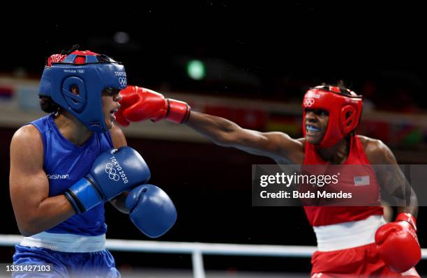 Oshae Jones of Team United States exchanges punches with Maria Altagracia Moronta Hernandez of Team Dominican Republic during the Women's Welter...