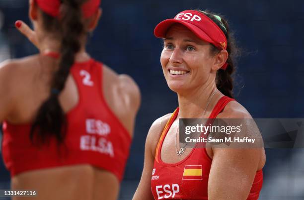 Liliana Fernandez Steiner and Elsa Baquerizo McMillan of Team Spain react against Team China during the Women's Preliminary - Pool B beach volleyball...