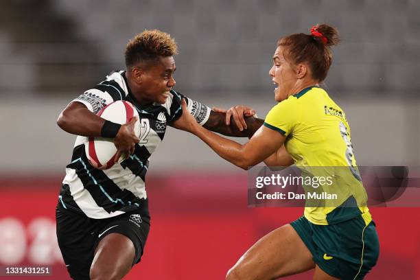 Roela Radiniyavuni of Team Fiji puts a fend on Charlotte Caslick of Team Australia in the Women’s Quarter Final match between Team Fiji and Team...