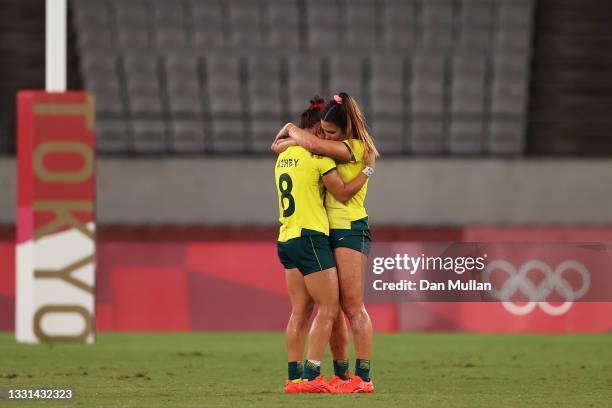 Madison Ashby and Charlotte Caslick of Team Australia look dejected at full time in the Women’s Quarter Final match between Team Fiji and Team...