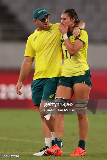 Demi Hayes of Team Australia is consoled by Team Australia assistant coach James Stannard after the Women’s Quarter Final match between Team Fiji and...