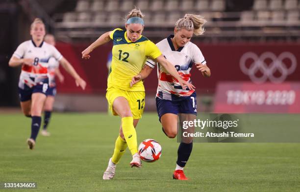 Ellie Carpenter of Team Australia battles for possession with Rachel Daly of Team Great Britain during the Women's Quarter Final match between Great...