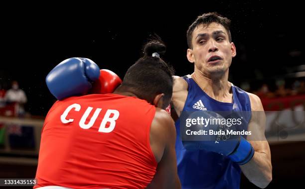 Arlen Lopez of Team Cuba exchanges punches with Rogelio Romero Torres of Team Mexico during the Men's Light Heavy quarter final on day seven of the...