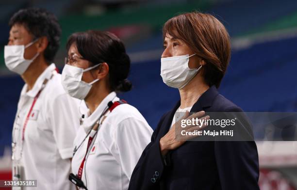Asako Takakura, Head Coach of Team Japan stands for the national anthem prior to the Women's Quarter Final match between Sweden and Japan on day...