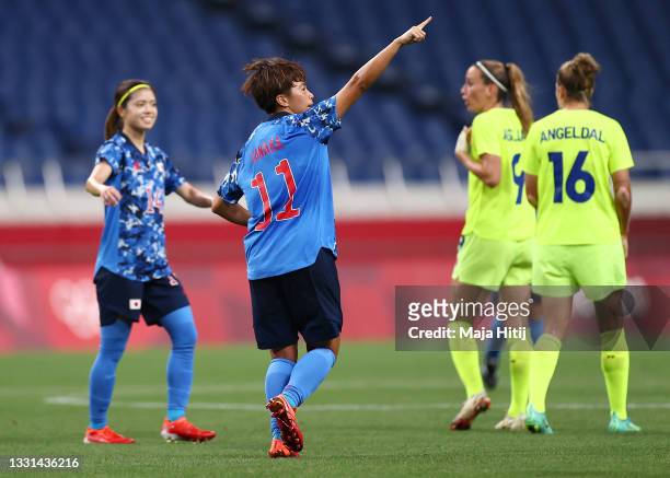 Mina Tanaka of Team Japan celebrates after scoring their side's first goal during the Women's Quarter Final match between Sweden and Japan on day...