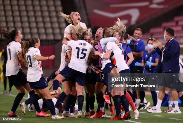 Ellen White of Team Great Britain celebrates with team mates after scoring their side's second goal during the Women's Quarter Final match between...