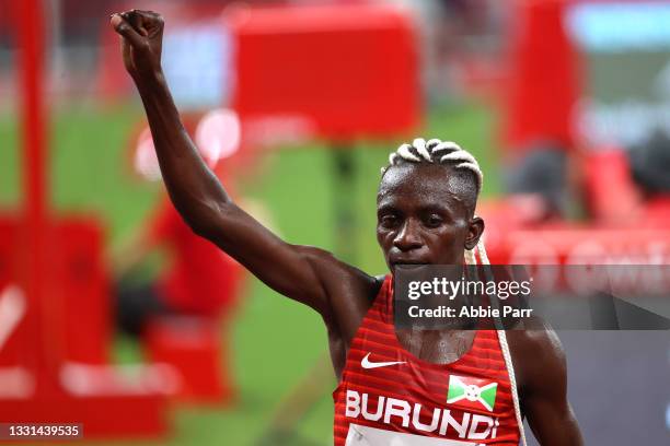 Francine Niyonsaba of Team Burundi reacts after crossing the finish line during round one of the Women's 5000 meters on day seven of the Tokyo 2020...