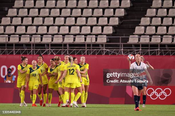 Sam Kerr of Team Australia celebrates with team mates after scoring their side's second goal during the Women's Quarter Final match between Great...