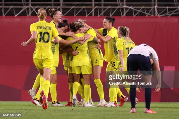 Sam Kerr of Team Australia celebrates with team mates after scoring their side's second goal during the Women's Quarter Final match between Great...