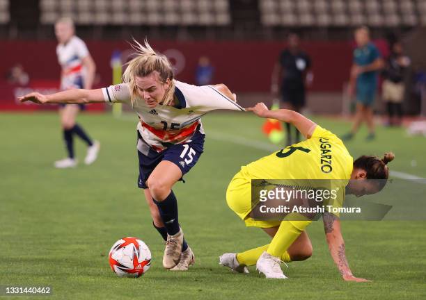 Lauren Hemp of Team Great Britain battles for possession with Chloe Logarzo of Team Australia during the Women's Quarter Final match between Great...