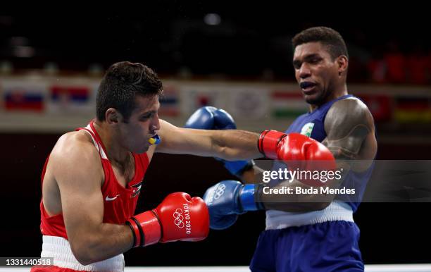 Hussein Eishaish Hussein Ishaish of Team Jordan exchanges punches with Abner Teixeira of Team Brazil during the Men's Heavy quarter final on day...