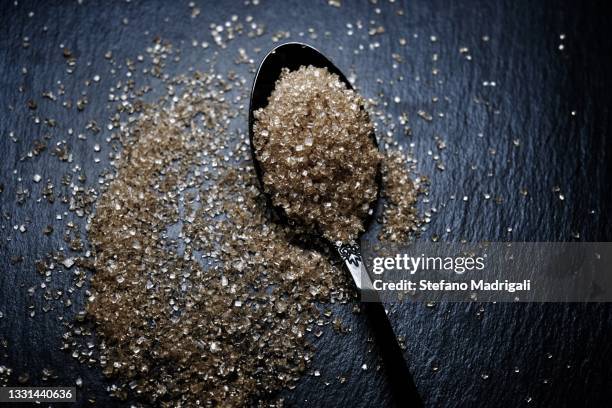 brown sugar on spoon - turbinadosocker bildbanksfoton och bilder