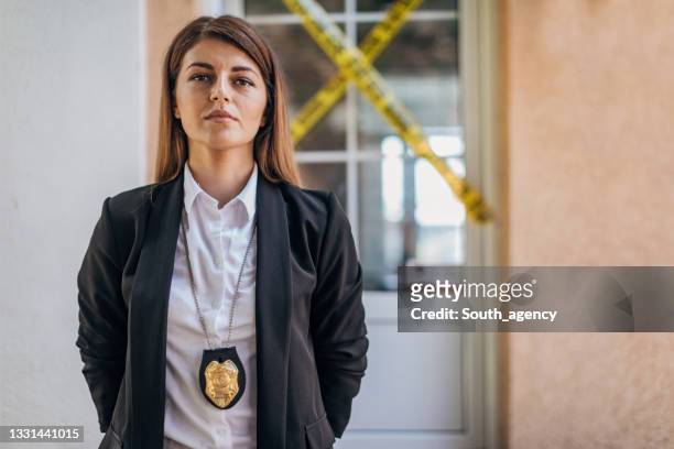 woman detective at the crime scene - fbi stock pictures, royalty-free photos & images