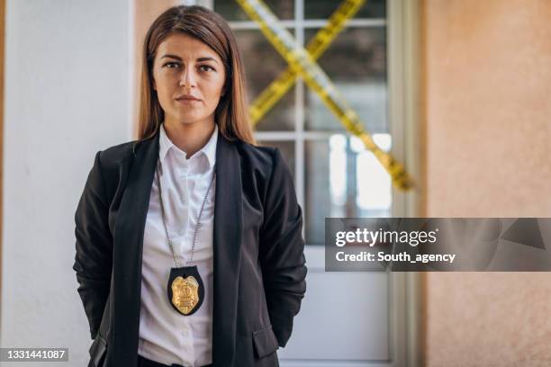 woman detective at the crime scene - detective badge stock pictures, royalty-free photos & images