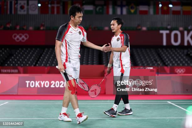 Mohammad Ahsan and Hendra Setiawan of Team Indonesia react as they competes against Lee Yang and Wang Chi-lin of Team Chinese Taipei during a Men’s...