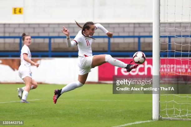 Lucy Watson of England touches the ball into the net but the goal is awarded to Emily Murphy of England during a Women's U19's friendly match between...