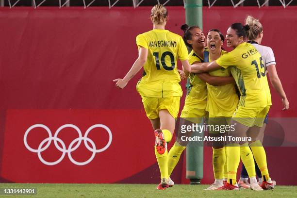 Sam Kerr of Team Australia celebrates with team mates after scoring their side's fourth goal during the Women's Quarter Final match between Great...