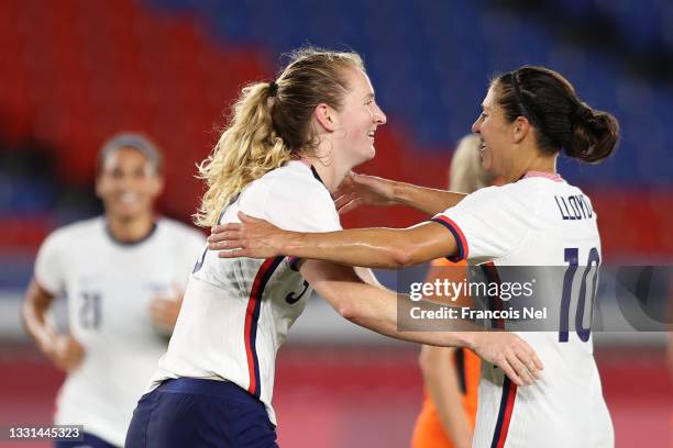 Samantha Mewis of Team United States celebrates with Carli Lloyd after scoring their side's first goal during the Women's Quarter Final match between...
