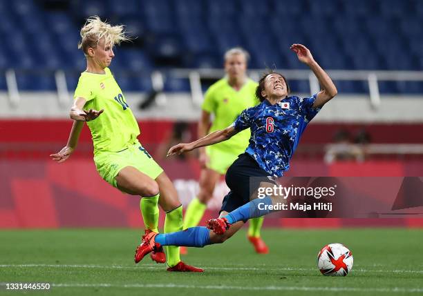 Hina Sugita of Team Japan is challenged by Sofia Jakobsson of Team Sweden during the Women's Quarter Final match between Sweden and Japan on day...