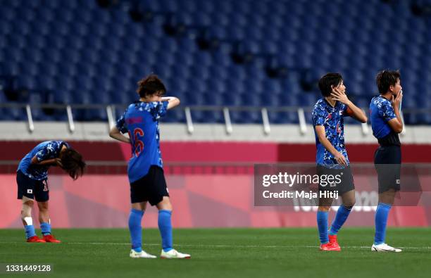 Saki Kumagai and Moeka Minami of Team Japan look dejected following defeat in the Women's Quarter Final match between Sweden and Japan on day seven...