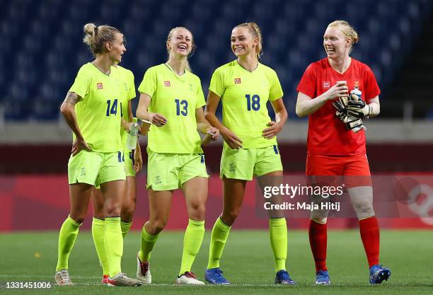 Nathalie Bjorn, Amanda Ilestedt, Fridolina Rolfo and Hedvig Lindahl of Team Sweden celebrate after victory in the Women's Quarter Final match between...