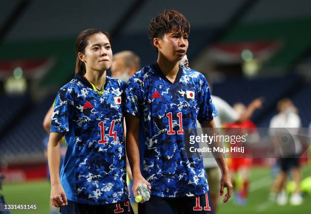 Yui Hasegawa and Mina Tanaka of Team Japan look dejected following defeat in the Women's Quarter Final match between Sweden and Japan on day seven of...