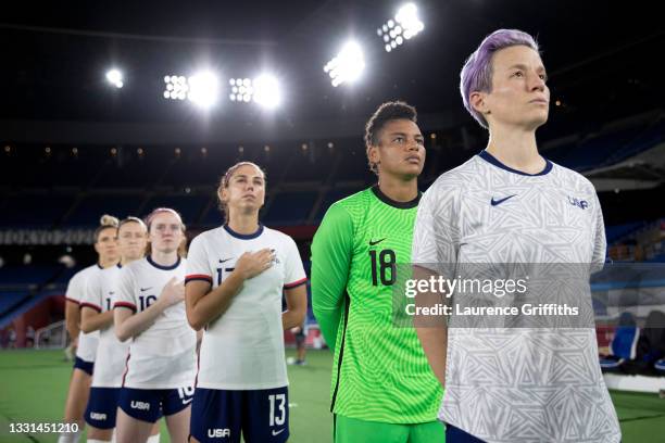 Adrianna Franch and Megan Rapinoe of Team United States stand for the national anthem prior to the Women's Quarter Final match between Netherlands...