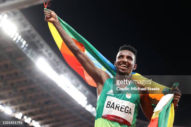 Selemon Barega of Team Ethiopia celebrates winning gold in the Men's 10,000 metres Final on day seven of the Tokyo 2020 Olympic Games at Olympic...
