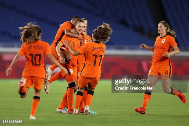Vivianne Miedema of Team Netherlands celebrates with team mates after scoring their side's second goal during the Women's Quarter Final match between...