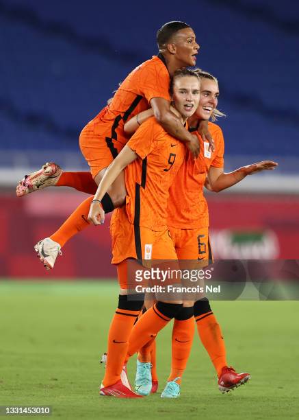 Vivianne Miedema of Team Netherlands celebrates with Shanice van de Sanden and Jill Roord after scoring their side's second goal during the Women's...