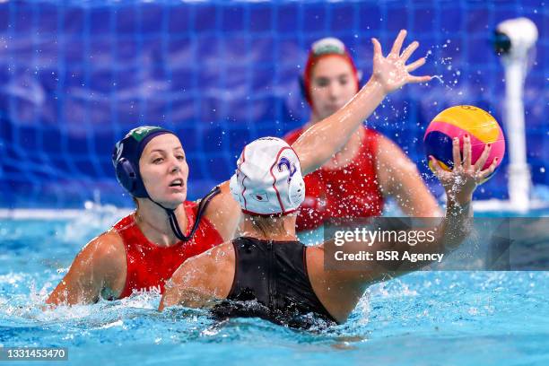 Gabriella Szucs of Hungary y, Yumi Arima of Japan during the Tokyo 2020 Olympic Waterpolo Tournament women match between Japan and Hungary at Tatsumi...