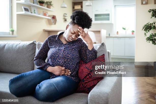 the pain is worsening by the minute - intestines stockfoto's en -beelden