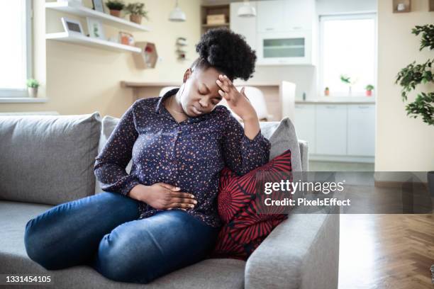 the pain is worsening by the minute - headache medicine stock pictures, royalty-free photos & images