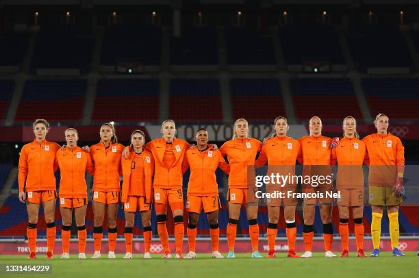 Players of Team Netherlands stand for the national anthem prior to the Women's Quarter Final match between Netherlands and United States on day seven...