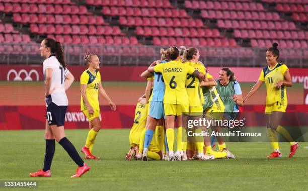 Players of Team Australia celebrate their side's victory after the Women's Quarter Final match between Great Britain and Australia on day seven of...