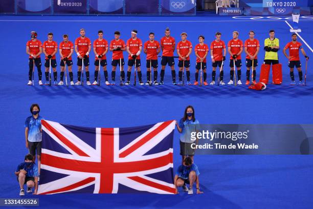 Team Great Britain line up for their national anthem prior to the Men's Preliminary Pool B match between Belgium and Great Britain on day seven of...