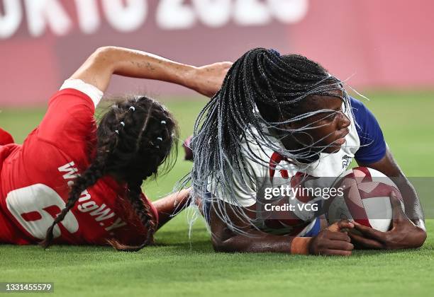 Seraphine Okemba of Team France is tackled by Wang Wanyu of Team China in the Women's Rugby Sevens Quarter-final match between Team France and Team...