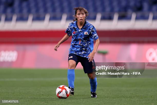 Emi Nakajima of Team Japan on the ball during the Women's Quarter Final match between Sweden and Japan on day seven of the Tokyo 2020 Olympic Games...